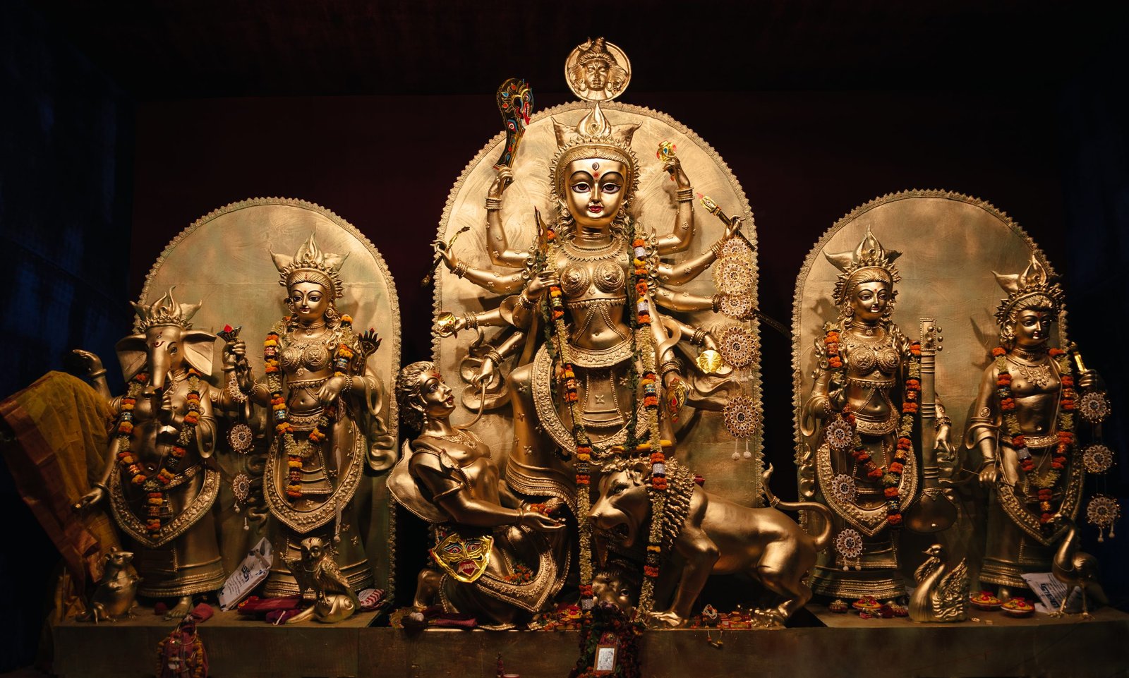 Durga Puja tableau with Durga, her lion, Mahisha and accompanying deities at GD Block, Salt Lake, Kolkata.