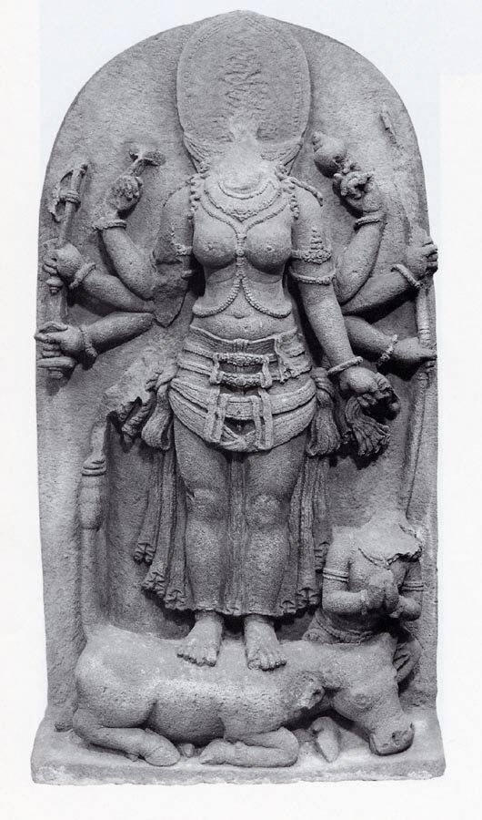 Stone sculpture of Durga standing above the defeated buffalo demon Mahisha.