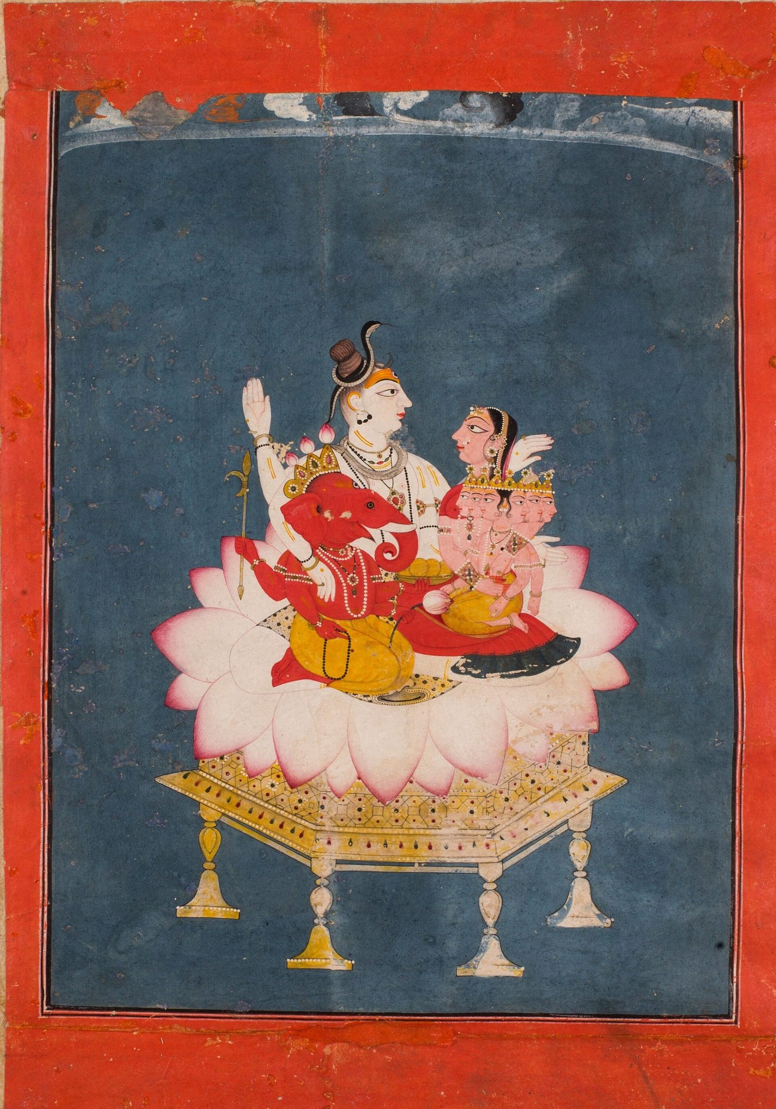 Pahari painting of Shiva and Parvati seated on a pink lotus pedestal, with Ganesha beside Shiva and Kartikeya on Parvati's lap against a blue background.