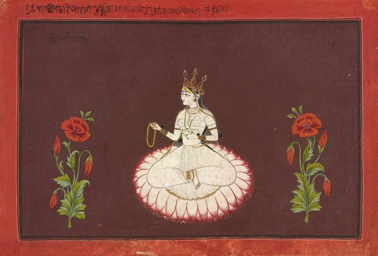 Sawar painting of white-clad Saraswati seated on a pink-edged lotus, holding a rosary between two flowering red poppy plants.